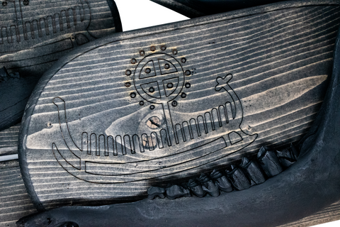 Image of viking ship petroglyph blackened elk jawbone hanger