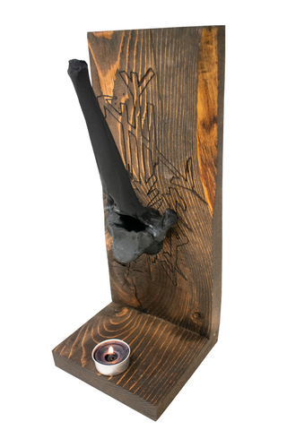 Image of protection bindrune and blackened elk vertebra altar