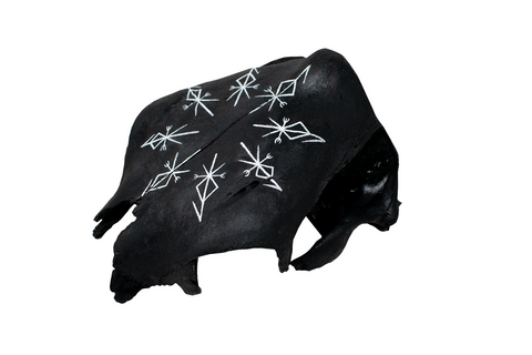 Image of partial cow skull with repeating Loki bindrunes