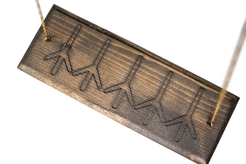 Image of Coyote Bone Wind Chime with Repeating Algiz Runes