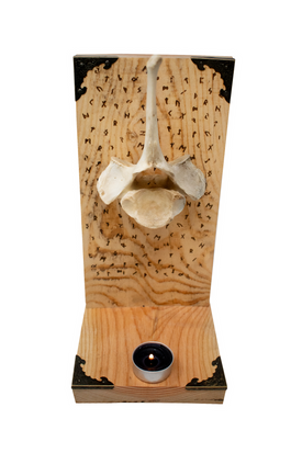 runic cow vertebra altar