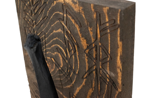 Image of triple bindrune and blackened elk vertebra altar
