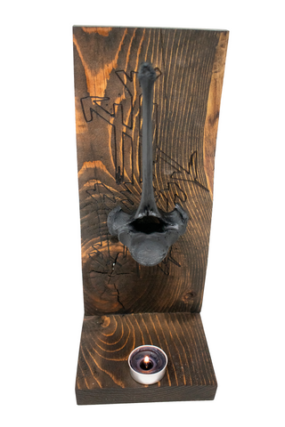 Image of protection bindrune and blackened elk vertebra altar