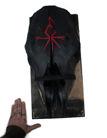 Image of blackened loki bindrune cow skull hanger