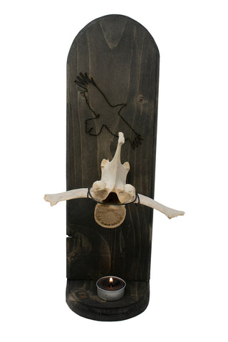 Image of elk vertebra and raven altar