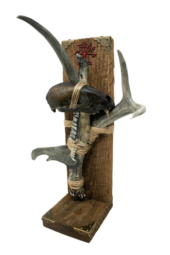 Blackened connection to the gods altar with bone sculpture
