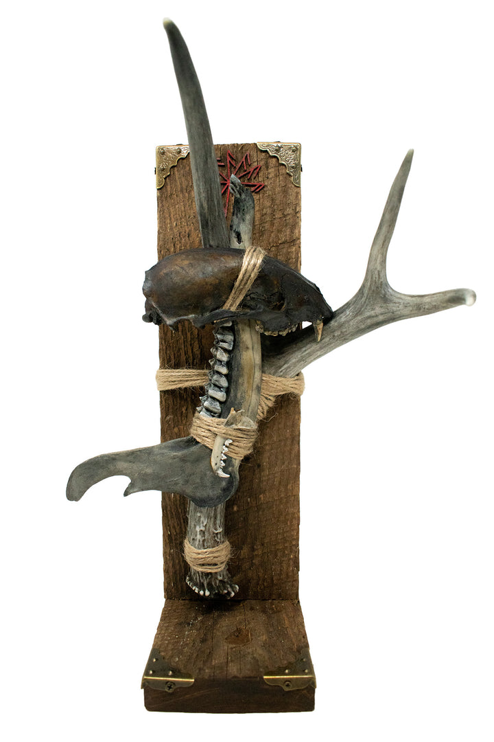 Blackened connection to the gods altar with bone sculpture