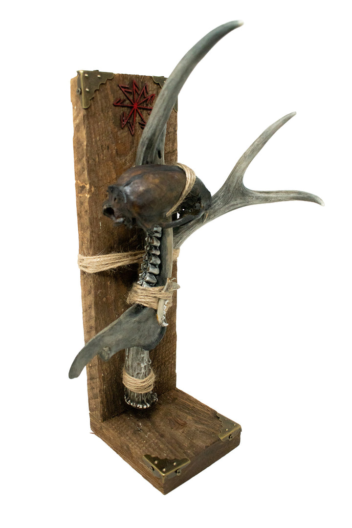 Blackened connection to the gods altar with bone sculpture