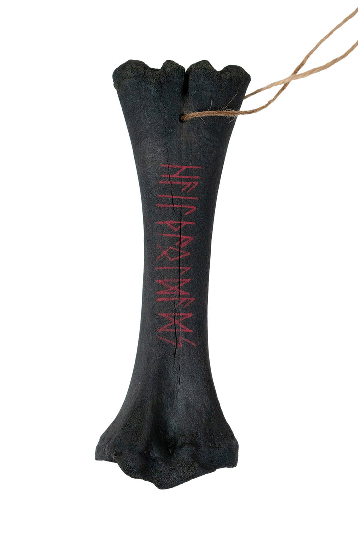 blackened ritual leg bone talismans